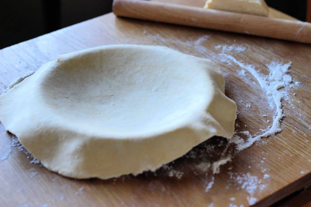 easy pie crust draped over tin