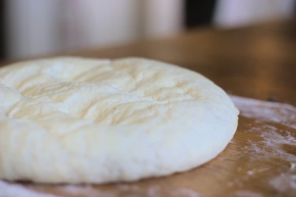 punched down dough after rising, ready to shape