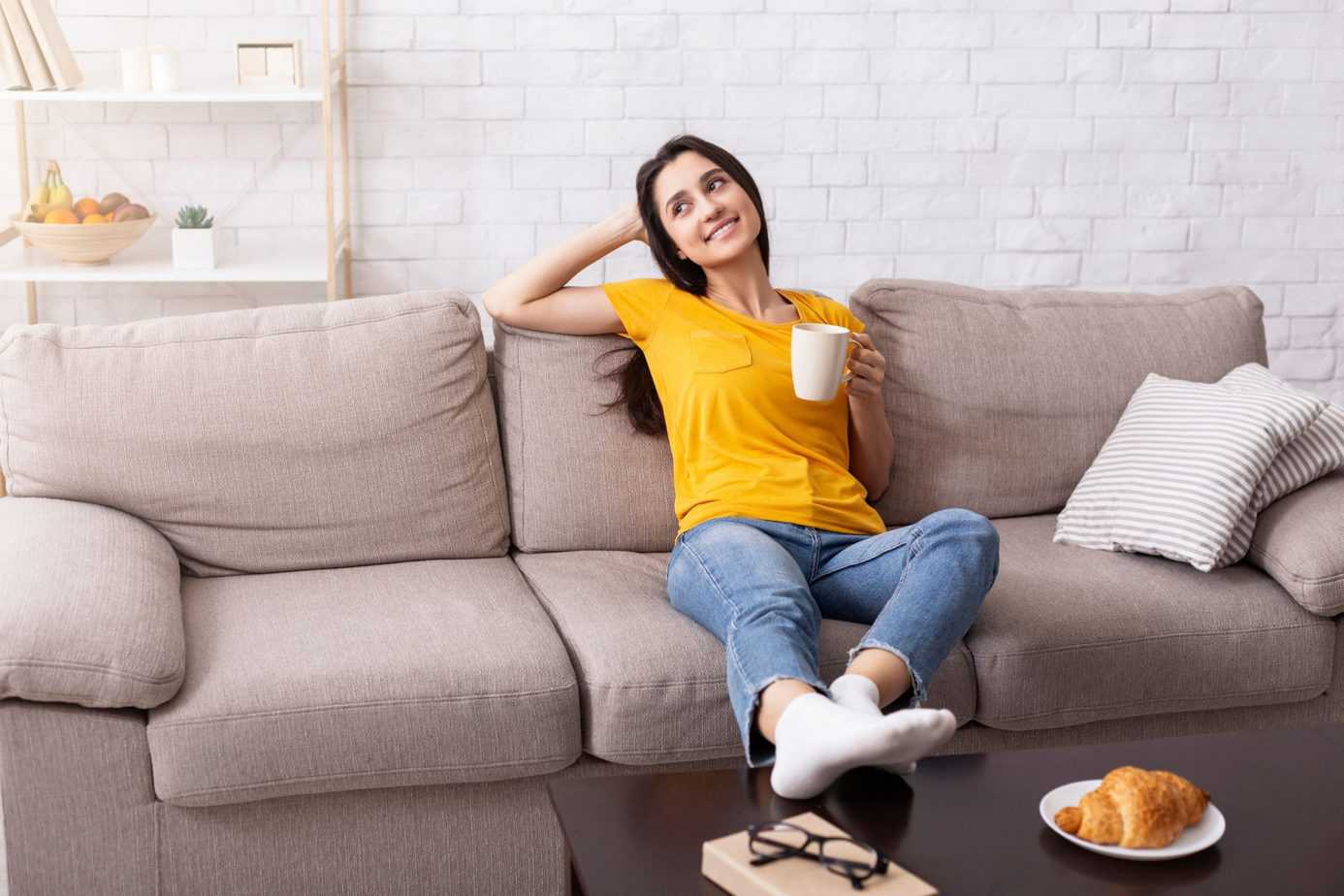 mother sitting on couch enjoying quiet time